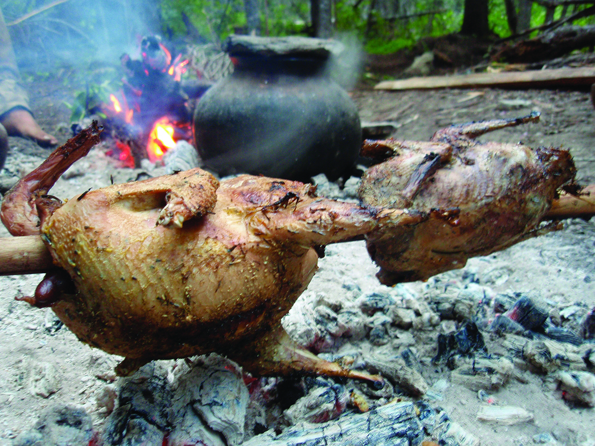 Photo by Thomas J. Elpel Roasting Grouse, Survival Skills